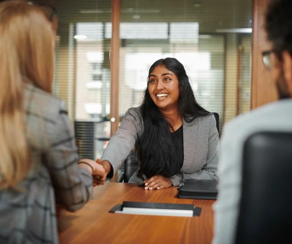Job seeker editing a cover letter draft on a desk.