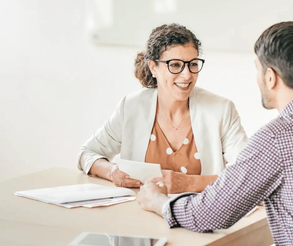 Job seeker drafting a skills-based resume with sticky notes.
