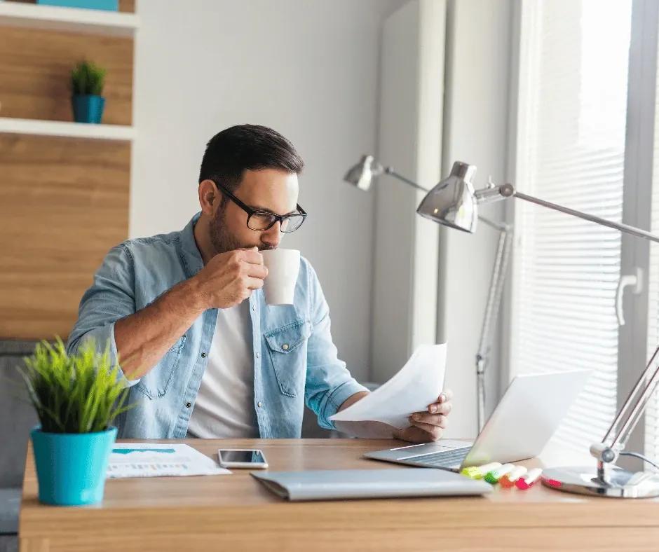 Professional mapping a job search sprint with sticky notes and a laptop.